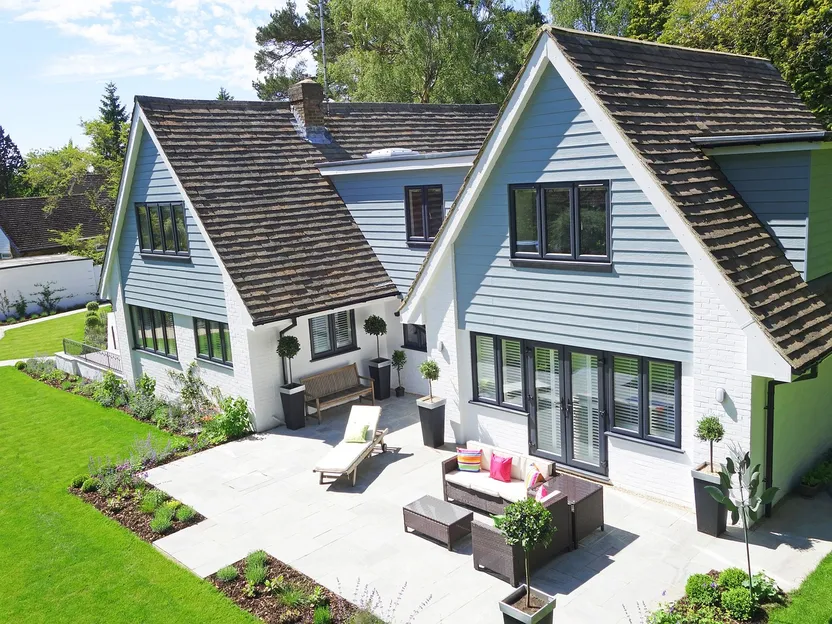 charcoal grey grey house with black trim
